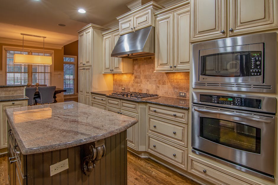 A stylish kitchen featuring stainless steel appliances and luxurious counter space.